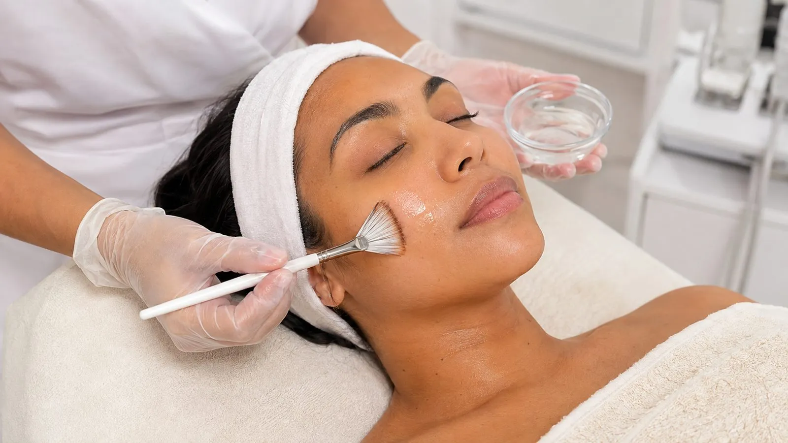 A clinician applying a treatment